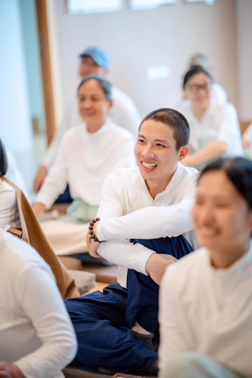 A participant smiling in the group