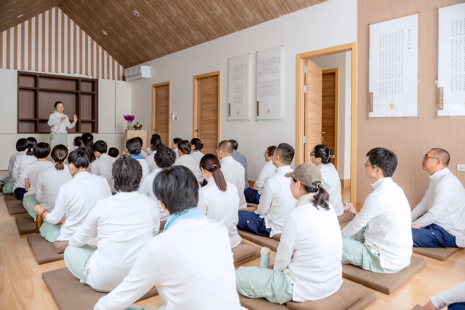A group listening in the practice room